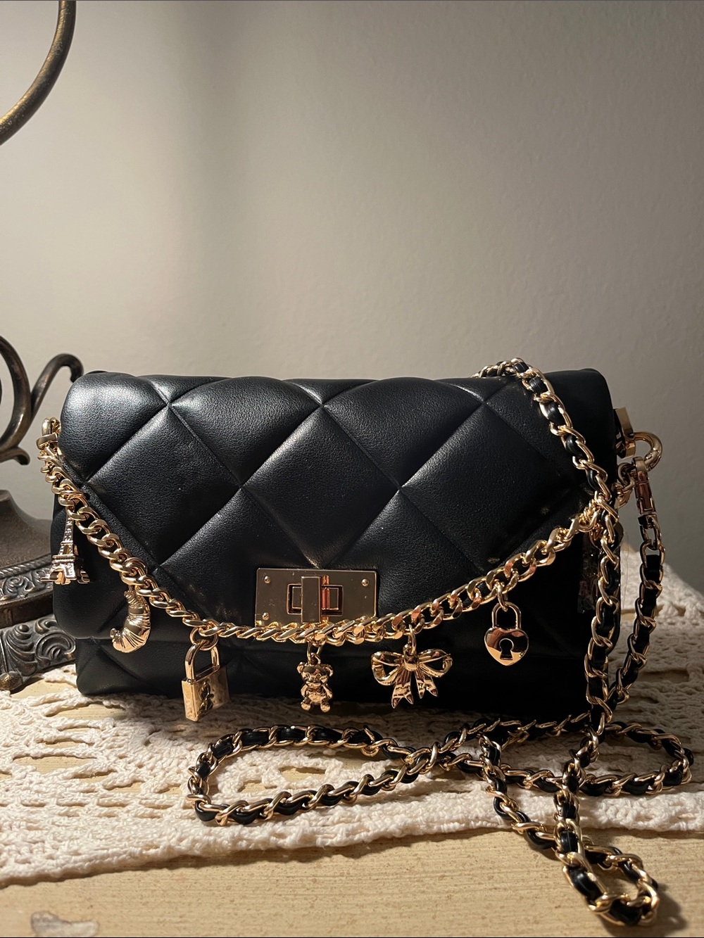 ALDO Black Leather Crossbody Bag with Gold
Charm Detail